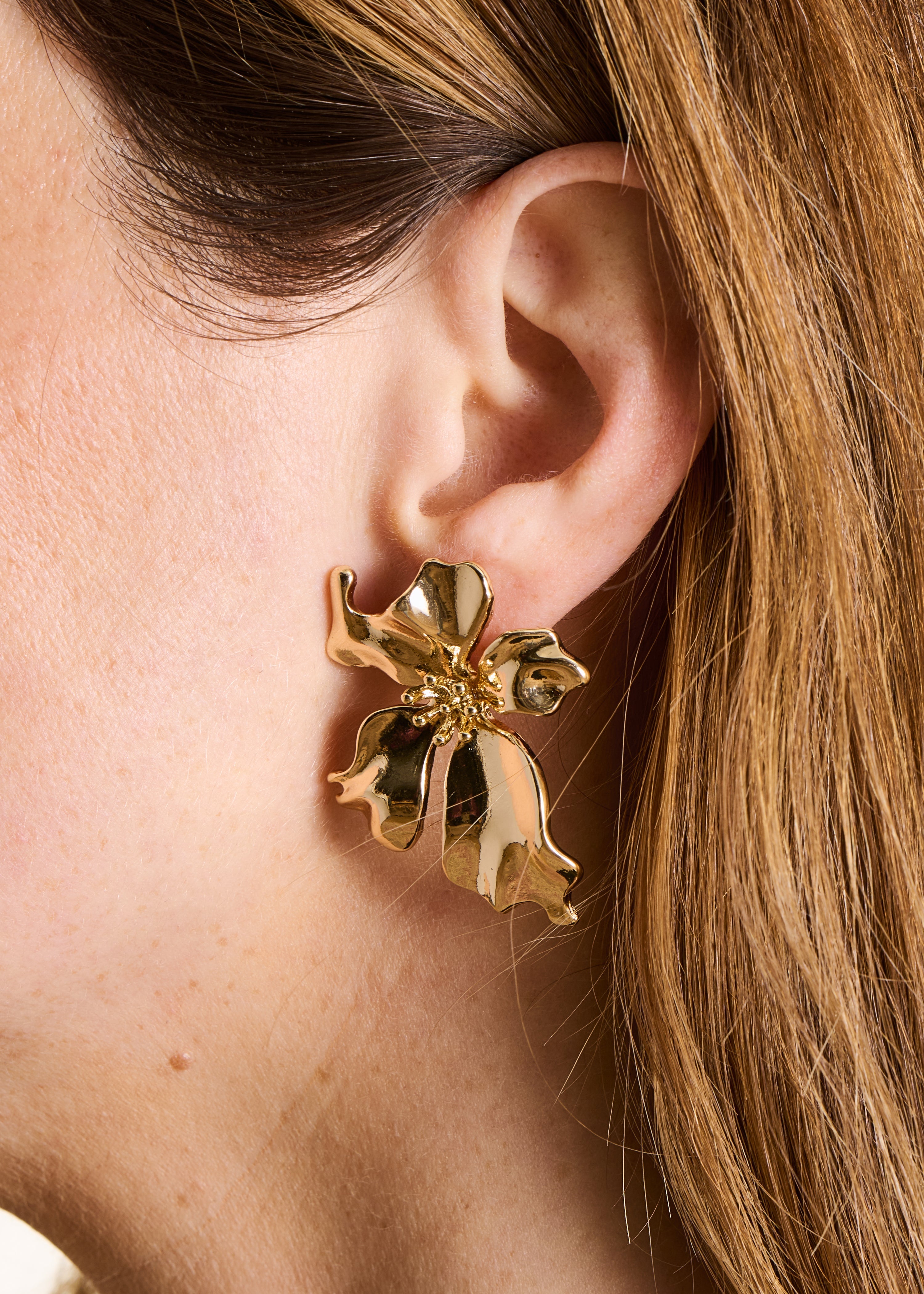 Boucles d'oreilles fleur pendantes dorées